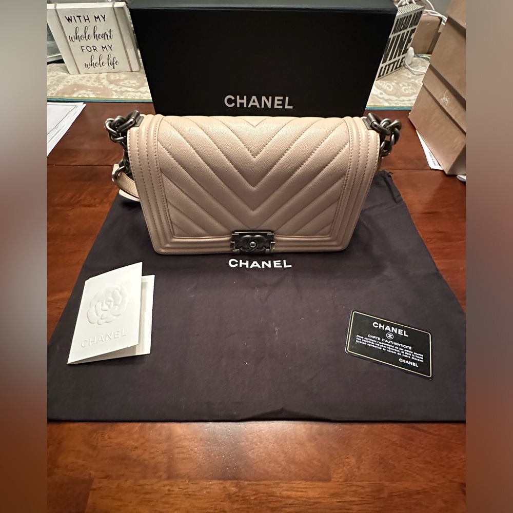 Chanel Medium Boy Flap in blush Caviar Calfskin & Ruthenium-Finish Metal.